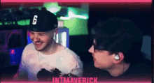 a man wearing a hat with the number 6 on it is talking to another man