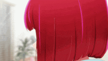 a close up of a girl 's red hair with a palm tree in the background