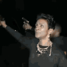a blurry picture of a woman dancing in the dark .