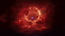 a glowing sphere is surrounded by red clouds in a dark space
