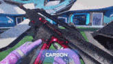 a person is holding a gun that says carbon on the bottom