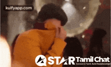 a star tamil chat advertisement shows a man in an orange jacket