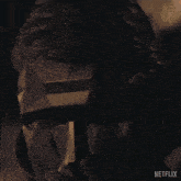 a close up of a man 's face with the word netflix on the bottom right