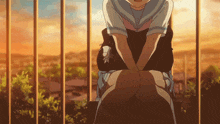a girl in a sailor uniform sits on a bench with her legs crossed