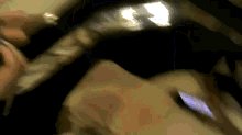 a blurry picture of a person holding a cellphone