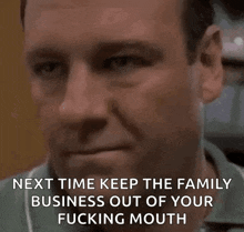 a close up of a man 's face with the words `` next time keep the family business out of your fucking mouth ''