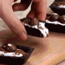 a close up of a person making a dessert with mr. cakes written in the corner