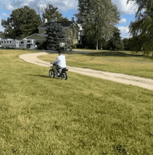a person riding a motorcycle down a dirt path