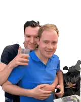 a man in a blue shirt is hugging another man who is holding a cup