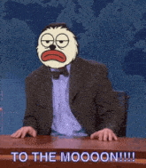 a man in a suit with a cartoon face on his head says " to the moooon !!! "