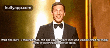 a man in a tuxedo and bow tie is giving a speech about hollywood