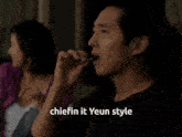 a man smoking a cigarette with the words " chiefin it yeun style " written below him