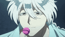a man with white hair is holding a pink lollipop