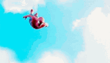 a person in a red spiderman costume is flying through the air