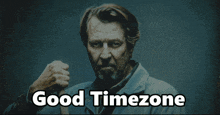 a man with a beard is giving a thumbs down sign and the caption reads good timezone