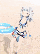 a girl in a bikini is laying on the sand