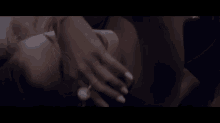 a close up of a woman laying on her stomach with her hands on her face .