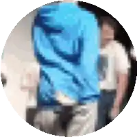 a blurry picture of a man in a blue shirt
