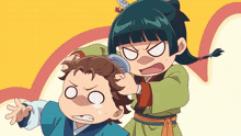 a girl is brushing a boy 's hair and making a face