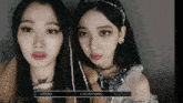two girls are standing next to each other and one of them has the name karina on the screen