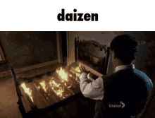 a man is sitting in front of a bed that is on fire with the word daizen above him