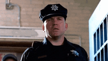 a police officer with a star on his hat