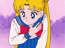 a girl in a sailor suit is hugging herself with her hands on her chest