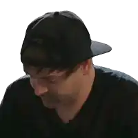 a man wearing a black hat with nkc on the back