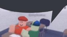 a blurry picture of a man in a red hat sitting at a desk in a classroom .