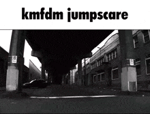 a black and white photo of a street with kmfdm jumpscare written above it