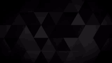 a black background with a pattern of black triangles on it