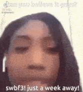 a woman is wearing headphones and making a funny face .