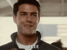 a close up of a man 's face with the word eee on it .