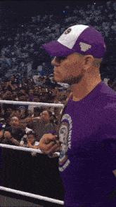 a wrestler wearing a blue shirt with the number 3 on it