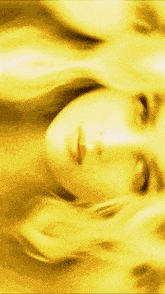 a close up of a woman 's face in a red light