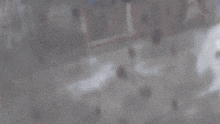 a blurry picture of a person in a bubble with a blue background
