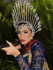 a woman wearing a crown with a lot of rhinestones