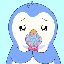 a penguin holding a pink and blue lollipop with a bow on it