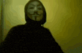 a shadow of a person wearing a hooded mask
