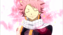 a boy with pink hair and a scarf around his neck is smiling