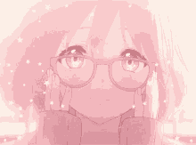 a girl with glasses and a ring on her finger is smiling