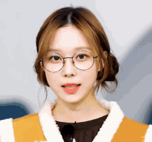 a close up of a woman wearing glasses