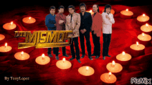 a group of men standing in front of candles with the words los mismos on the top