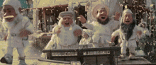 a group of gnomes are standing in front of a store