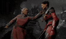 a woman in a red dress is standing next to another woman in a red costume