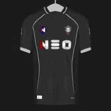 a black neo jersey with white trim hangs on a hanger
