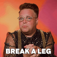 a man wearing glasses says break a leg in white letters