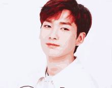 a young man with red hair is wearing a white shirt and looking at the camera