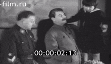 a black and white photo of a man with the time 00 00 02 13