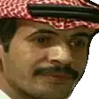a man with a mustache and a hat is wearing a head scarf .